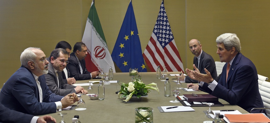 U.S. Secretary of State John Kerry, right, during official talks with Iranian Foreign Minister Mohammad Javad Zarif, left, in Geneva, Switzerland, Saturday, May 30, 2015.
