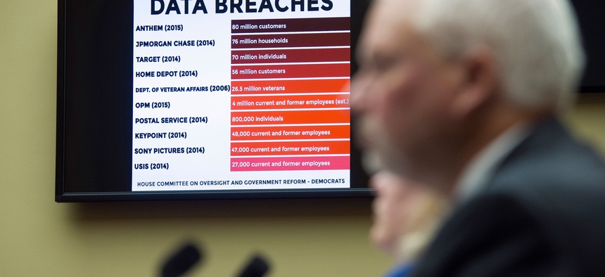 A chart of data breaches is shown on Capitol Hill in Washington, Tuesday, June 16, 2015, as witnesses testify before the House Oversight and Government Reform committee's hearing on the Office of Personnel Management (OPM) data breach.