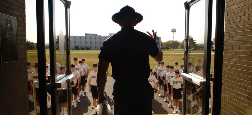 A U.S. Coast Guard company commander instructs new recruits to stand up straight outside of Sexton Hall at Coast Guard Training Center Cape May, NJ, Sept. 22, 2005.