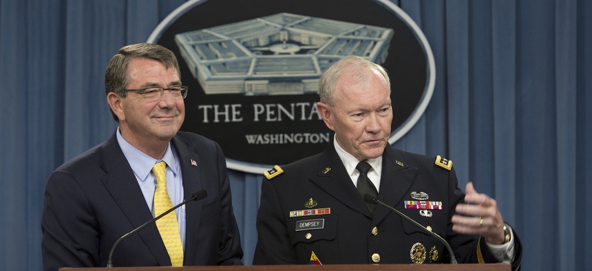 Secretary of Defense Ash Carter and Army Gen. Martin E. Dempsey, chairman of the Joint Chiefs of Staff, brief reporters during a news conference at the Pentagon July 1, 2015.