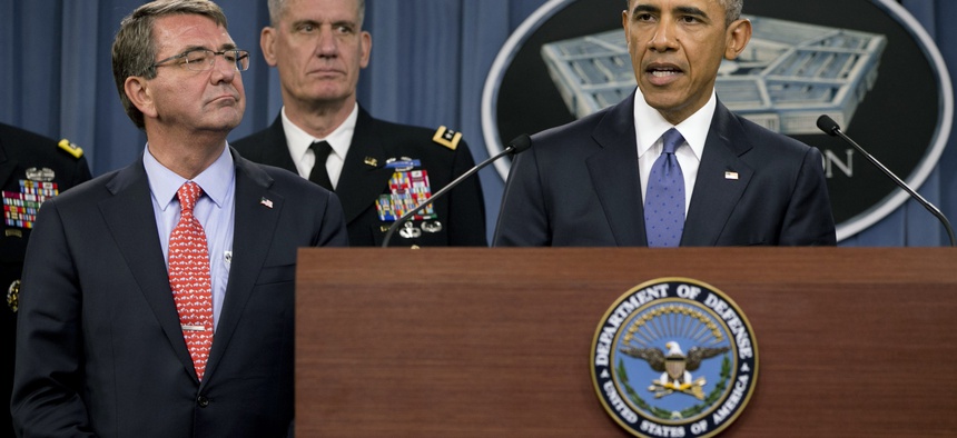 President Barack Obama, right, speaks to the media after receiving an update from military leaders on the campaign against the Islamic State, during a rare visit to the Pentagon on Monday, July 6, 2015.