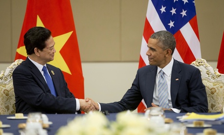 U.S. President Barack Obama, right, and Vietnam's Prime Minister Nguyen Tan Dung, shake hands during their bilateral meeting at the Myanmar International Convention Center, Thursday, Nov. 13, 2014 in Naypyitaw, Myanmar. U.S. President Barack Obama, right, and Vietnam's Prime Minister Nguyen Tan Dung, shake hands during their bilateral meeting at the Myanmar International Convention Center, Thursday, Nov. 13, 2014 in Naypyitaw, Myanmar.