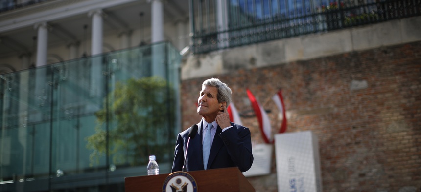 U.S. Secretary of State John Kerry pauses as he listen a question from a journalist after delivering a statement on the Iran talks in Vienna.