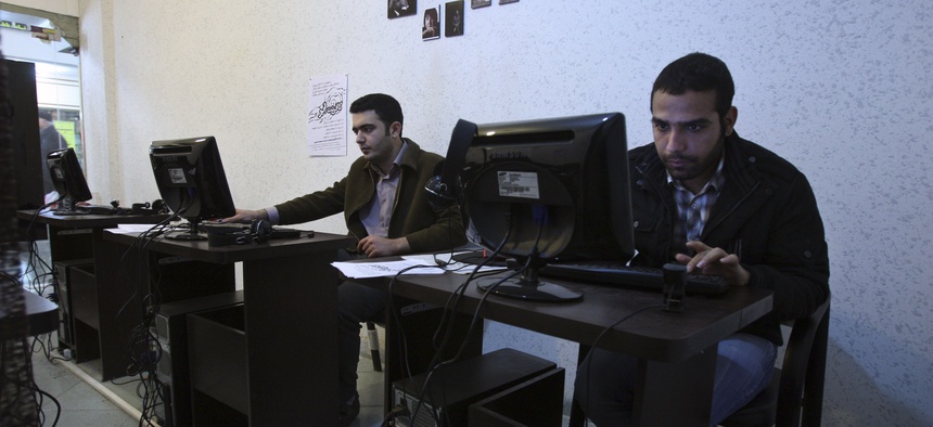 In this picture taken on Tuesday, Jan. 18, 2011, Iranian journalism students use computers in an internet cafe in central Tehran, Iran.