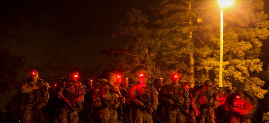 U.S. Army Soldiers conduct a 12-mile foot march during the Ranger Course on Fort Benning, GA., April 23, 2015.