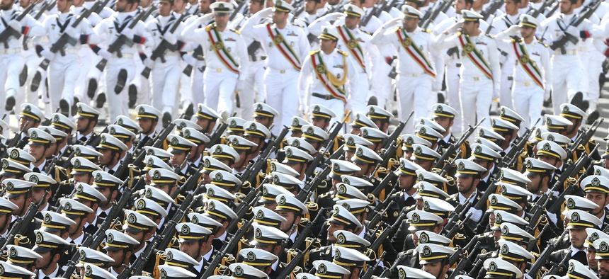 Iranian navy troops march in a parade marking National Army Day in front of the mausoleum of the late revolutionary founder Ayatollah Khomeini, just outside Tehran, Iran, Saturday, April 18, 2015.