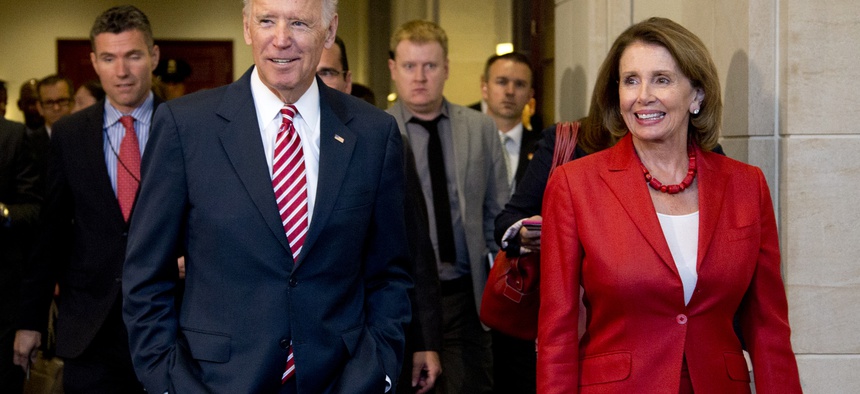 Vice President Joe Biden and House Minority Leader Nancy Pelosi of Calif., leave a meeting with the House Democratic Caucus to discuss the Iran nuclear deal, Wednesday, July 15, 2015.