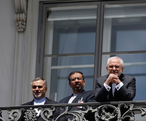 Iranian Foreign Minister Mohammad Javad Zarif reacts as he stands on a balcony with other members of his delegation outside of the current round of Iran nuclear talks, being held in Vienna, Austria July 10, 2015. Iranian Foreign Minister Mohammad Javad Zarif reacts as he stands on a balcony with other members of his delegation outside of the current round of Iran nuclear talks, being held in Vienna, Austria July 10, 2015.