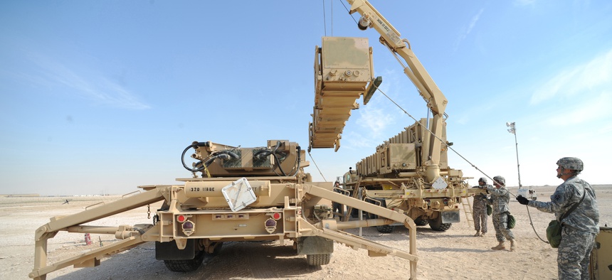 Army Patriot Launch Station operator/maintainers from Bravo Battery, 1-43 Air Defense Artillery, perform a missile reload certification at a non-disclosed Southwest Asia location, Feb. 12, 2010.