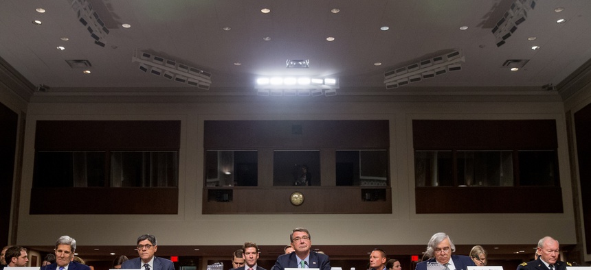 Secretary of State John Kerry, Treasury Secretary Jacob Lew, Defense Secretary Ash Carter, Energy Secretary Ernest Moniz and Joint Chiefs Chairman Gen. Martin Dempsey, prepare to testify on Capitol Hill in Washington, Wednesday, July 29, 2015.