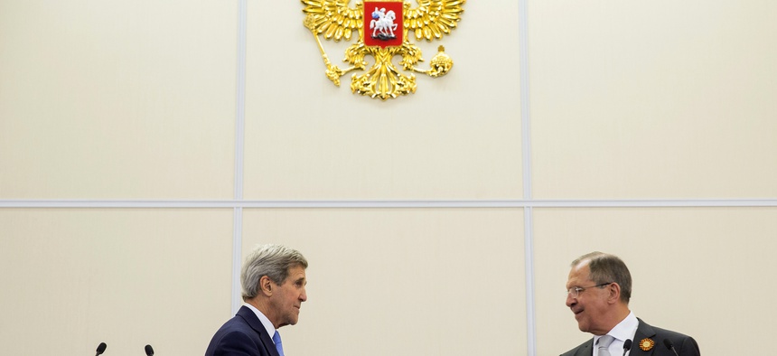 Russian Foreign Secretary Sergey Lavrov, right, and U.S. Secretary of State John Kerry, shake hands during a news conference at the presidential residence of Bocharov Ruchey in Sochi, Russia, Tuesday May 12, 2015.