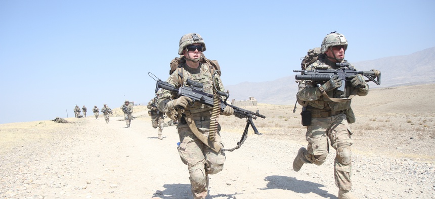 Third Brigade Combat Team, 101st Airborne Division soldiers sprint to their objective during a platoon live-fire training exercise July 3, 2015 at Tactical Base Gamberi in eastern Afghanistan.