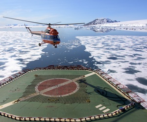 A helicopter lifts off the deck of the Russian nuclear-powered icebreaker 50 Years of Victory in the Arctic Sea on July 5, 2015. Used under Creative Commons Attribution 2.0 Generic. A helicopter lifts off the deck of the Russian nuclear-powered icebreaker 50 Years of Victory in the Arctic Sea on July 5, 2015. Used under Creative Commons Attribution 2.0 Generic.