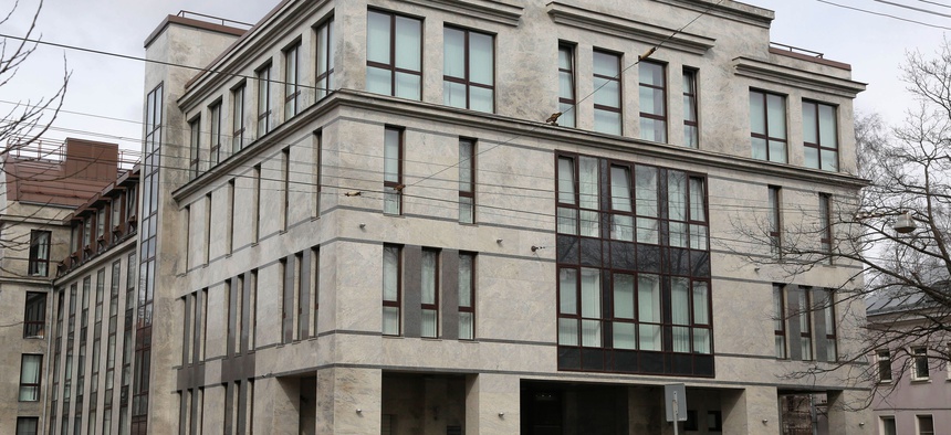 In this picture taken on Sunday, April 19, 2015, a women enters the four-story building known as the "troll factory" in St. Petersburg, Russia.