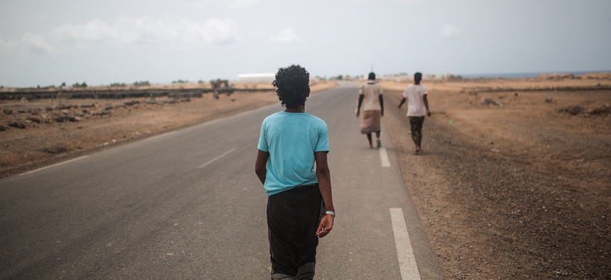 Yemeni refugee trek from their camp to the center of Obock city, northern Djibouti, May 20, 2015.
