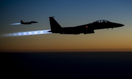 wo U.S. Air Force F-15E Strike Eagle aircraft fly over northern Iraq Sept. 23, 2014, after conducting airstrikes in Syria. wo U.S. Air Force F-15E Strike Eagle aircraft fly over northern Iraq Sept. 23, 2014, after conducting airstrikes in Syria.