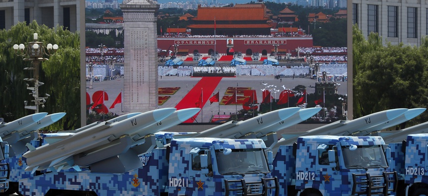 Military vehicles carry YJ anti-ship cruise missiles during a parade with more than 500 pieces of military hardware and 200 aircraft of various types, representing what military officials say is the Chinese military's most cutting-edge technology.