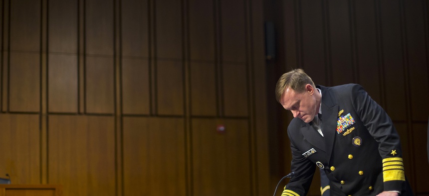 Director of the National Security Agency (NSA) Adm. Michael Rogers, waits for the arrival of Senate Intelligence Committee members before taking their seats on Thursday, September 24, 2015.