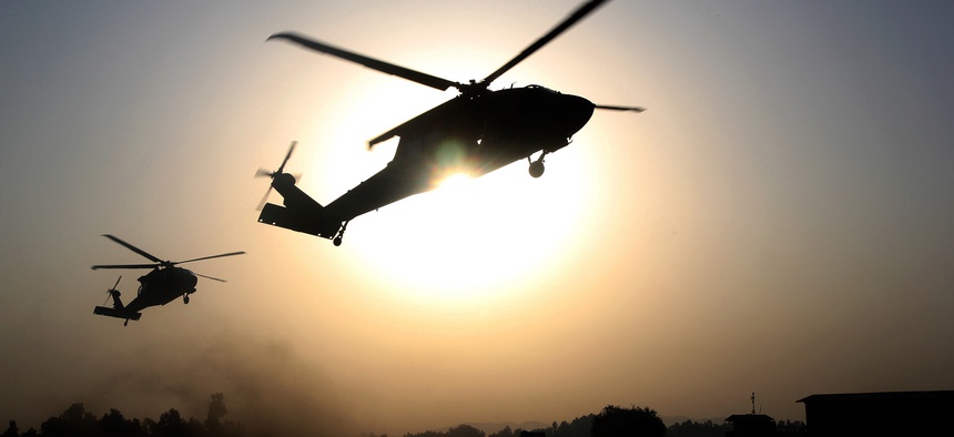 U.S. Army Soldiers, assigned to 101st Combat Aviation Brigade, 101st Airborne Division, hover over a landing zone in UH-60 Black Hawk helicopters during air assault training at Jalalabad Airfield in eastern Afghanistan, Sept. 16, 2015.