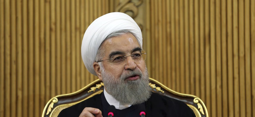 Iranian President Hassan Rouhani briefs media upon his arrival from the U.S. at Mehrabad airport in Tehran, Iran, Tuesday, Sept. 29, 2015.
