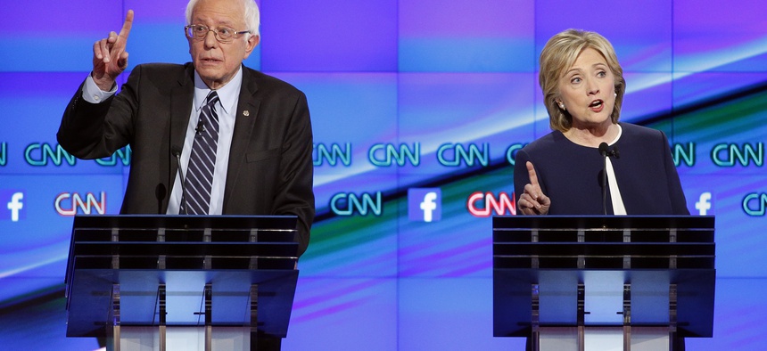 Former Secretary of State Hillary Clinton and Vermont Sen. Bernie Sanders spar at the CNN Democratic presidential debate in Las Vegas, Tues, Oct. 13, 2015.