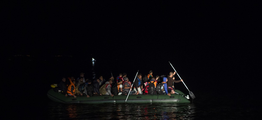 Migrants and refugees arrive on a dinghy from the Turkish coast to the northeastern Greek island of Lesbos, Monday, Oct. 19, 2015. More than 600,000 people, mostly Syrians, have reached Europe since the beginning of this year.