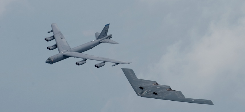 BARKSDALE AFB, La. -- A B-2 and B-52 fly in formation over Shreveport, La., on May 10 during the Defenders of Liberty Airshow and Open House.