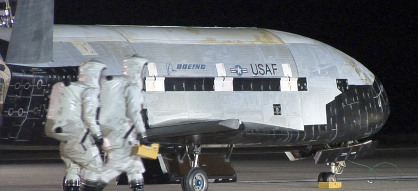 The USAF Rapid Capabilites Office help produce the X-37B Orbital Test Vehicle, a semi-secret space plane that sits on the runway after landing on Dec. 3, 2010, at Vandenberg Air Force Base, Calif.