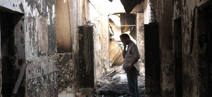 An employee of Doctors Without Borders stands in the hospital in Kunduz, Afghanistan, the day after an errant U.S. air attack, Oct. 16, 2015.
