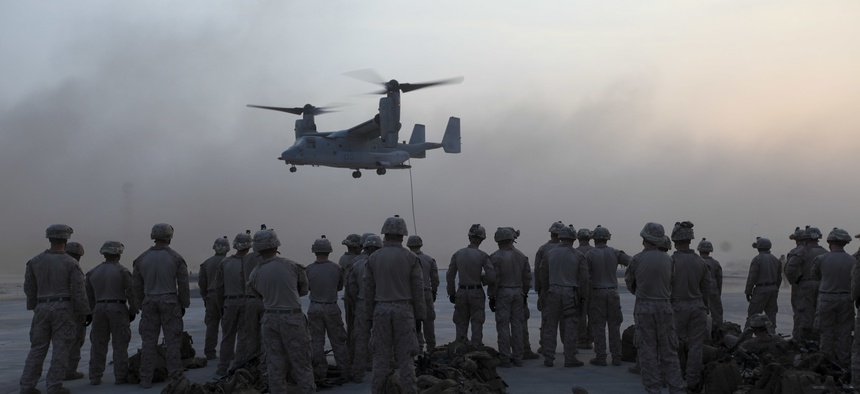 U.S. Marines with the Special Purpose Marine Air Ground Task Force—Crisis Response—Central Command, observe MV-22 Osprey fast rope training in Southwest Asia, Sept. 16, 2015.