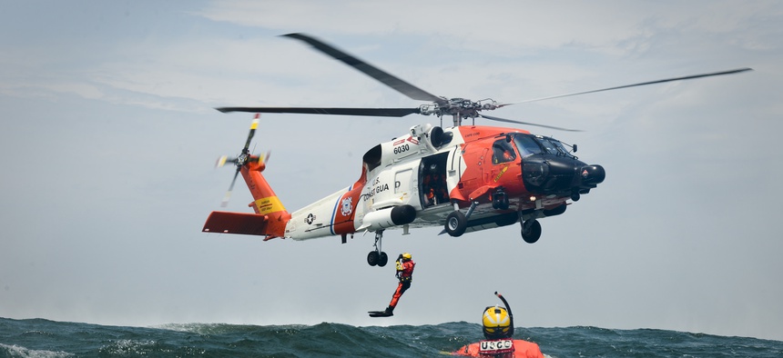 Rescue swimmers and aircrewmen from Coast Guard Air Station Cape Cod, Mass., conduct hoist training evolutions June 23, 2015.