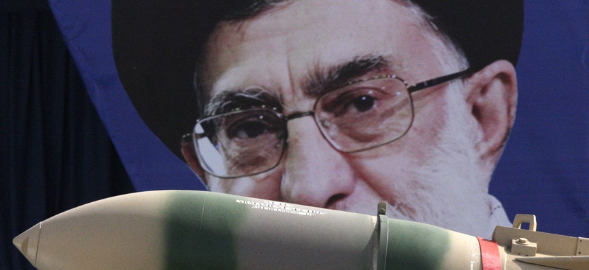 In this Thursday, April 18, 2013 file photo, a Yaser missile is displayed by the Iranian army in front of a portrait of supreme leader Ayatollah Ali Khamenei during a parade marking National Army Day.