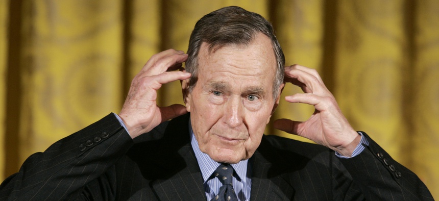 Former President George H.W. Bush gestures while telling a story as he speaks during a presentation ceremony for the Hugh S. Sidey Scholarship in Print Journalism, during a ceremony in the East Room of the White House in Washington Friday, Jan. 26, 2007.