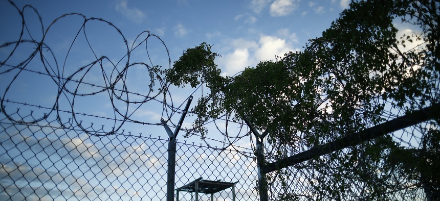 Concertina wire is overgrown with foliage in the now abandoned Camp X-Ray, Guantanamo Bay, Cuba which was used as the first detention facility for al-Qaida and Taliban militants who were captured after the Sept. 11 attacks.