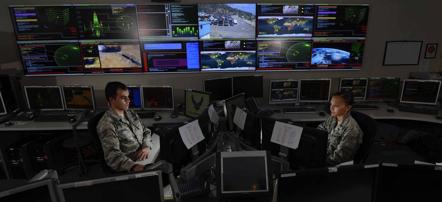 Staff Sgt. Alex Garviria and 2nd Lt. Rachel James work in the Global Strategic Warning and Space Surveillance System Center Sept. 2, 2014, at Cheyenne Mountain Air Force Station, Colo.