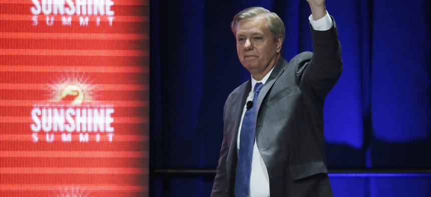 Republican presidential candidate, Sen. Lindsey Graham, R-SC, waves to the audience after addressing the Sunshine Summit in Orlando, Fla., Friday Nov. 13, 2015.