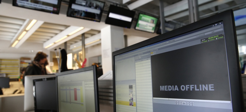 Computer screens are pictured at TV5 Monde after the French television network was hacked by people claiming allegiance to the Islamic State group, in Paris, France, Thursday April 9, 2015.