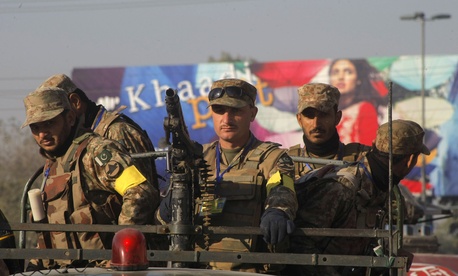 Pakistani army soldiers patrol outside the army public school during a ceremony in connection with first anniversary of the school attack in Peshawar, Pakistan, Wednesday, Dec. 16, 2015. Pakistani army soldiers patrol outside the army public school during a ceremony in connection with first anniversary of the school attack in Peshawar, Pakistan, Wednesday, Dec. 16, 2015.