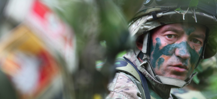Montenegrin army Sgt. Radomir Drobac takes position as he waits for the opposing force in an ambush exercise during the Immediate Response 2012 training event held in Slunj, Croatia on Friday, June 1, 2012.