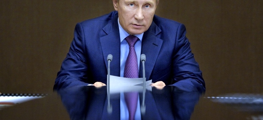 Russian President Vladimir Putin chairs a meeting with defense officials in the Bocharov Ruchei residence in the Black Sea resort of Sochi, Russia, Nov. 10, 2015.