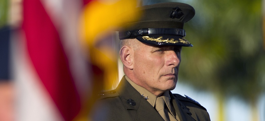 Gen. John F. Kelly stands at attention during the Southern Command change of command ceremony in Miami, Monday, Nov. 19, 2012. Defense Secretary Leon Panetta took part in a leadership change at U.S. Southern Command headquarters.