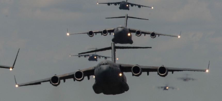 U.S. Airmen from Joint Base Charleston, S.C., conduct a multi-ship C-17 Globemaster III formation on May 21, 2015.