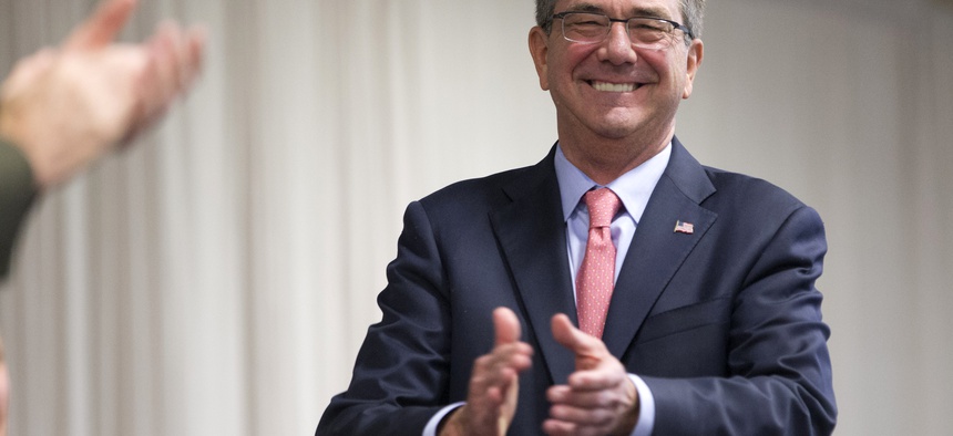 Defense Secretary Ash Carter applauds for outgoing Commander of the U.S. Southern Command, Marine Corps Gen. John F. Kelly, during a change of command ceremony at U.S. Southern Command, Thursday, Jan. 14, 2016, in Miami.