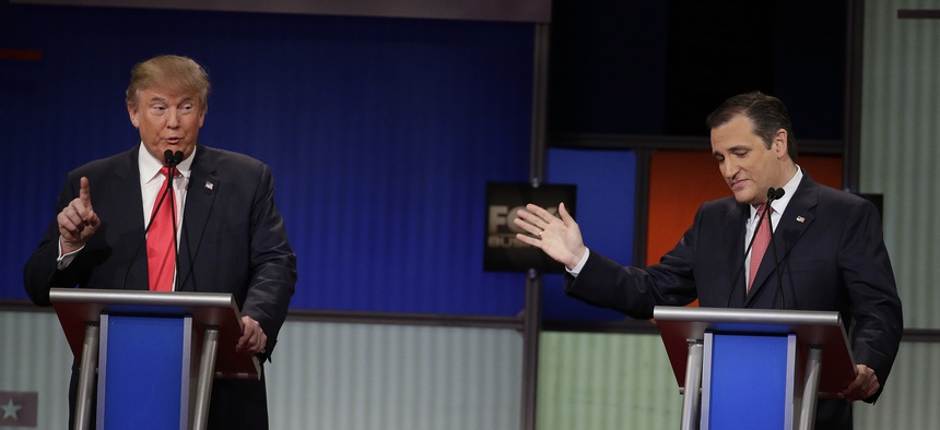 Republican presidential candidate Donald Trump speaks as Sen. Ted Cruz, R-Texas, looks on during the Fox Business Network Republican presidential debate, Jan. 14, 2016, in North Charleston, S.C.