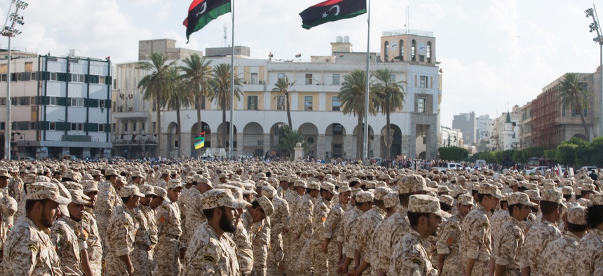 Military units which operate under the Tripoli government stand in formation during a celebration of the 75th anniversary of the establishment of the Libyan Army in Martyrs Square, Tripoli, Libya, August 2015.