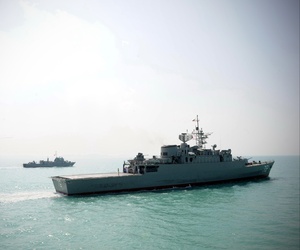 Iran's Jamaran guided-missile destroyer, is seen at right, in an exercise, in the Persian Gulf, Iran, Sunday, Feb. 21, 2010.