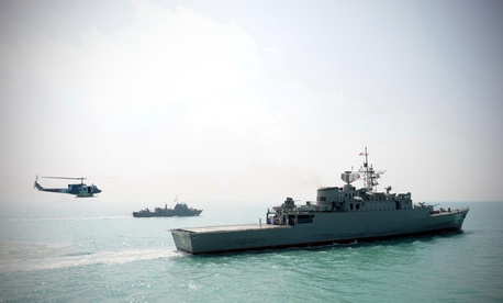 Iran's Jamaran guided-missile destroyer, is seen at right, in an exercise, in the Persian Gulf, Iran, Sunday, Feb. 21, 2010.
