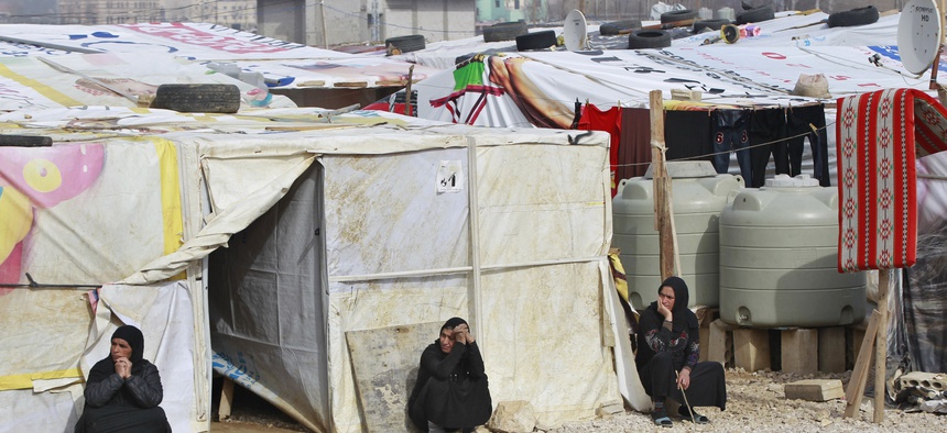 Syrian refugees women sitting outside their tents, during the visit of Filippo Grandi, the United Nations High Commissioner for Refugees, UNHCR, to a camp in the town of Saadnayel.