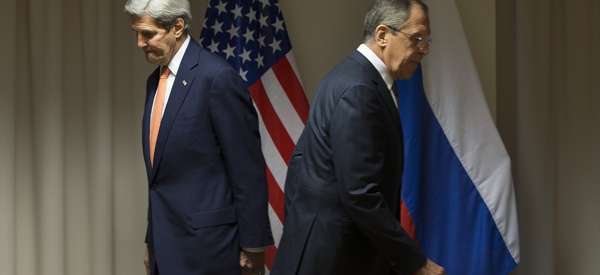 U.S. Secretary of State John Kerry, left, and Russian Foreign Minister Sergey Lavrov walk to their seats for a meeting about Syria, in Zurich, Switzerland, on Wednesday, Jan. 20, 2016.