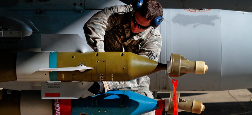 An Airman assembles fins on a GBU-12 Paveway II mounted on an F-16C Fighting Falcon on Jan. 9 at Atlantic City Air National Guard Base, N.J.